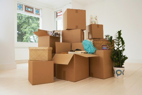 Packed storage unit in Muswellhill with labelled boxes and wrapped furniture