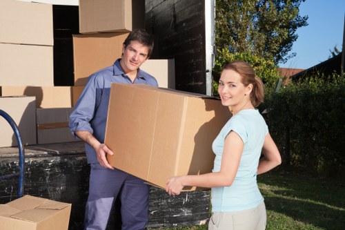 Customer handling boxed items with care in a storage corridor